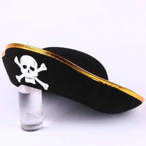 Close-up of black pirate hat with gold trim and white skull print on an acrylic stand