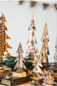 Detailed view of handmade birch bark Christmas tree ornaments on round wooden bases