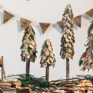Rustic birch bark Christmas trees with pine needles for holiday window display decoration