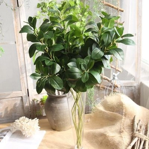 Artificial Nordic greenery faux foliage branches in glass vase for home interior decor
