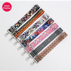 Various patterned replacement shoulder straps with silver metal buckles on a white background
