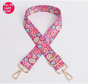 Close-up of adjustable colorful bohemian strap with light gold metal swivel hooks