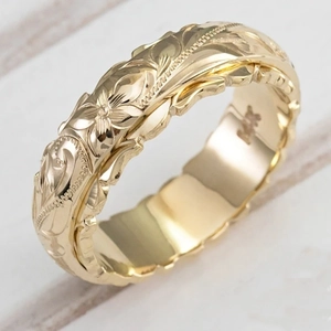 Wide gold ring with Hawaiian floral leaf relief engraving and beaded side detailing
