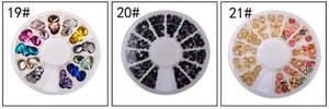 Three-pack nail art rhinestones in heart and bow shapes stored in 12-grid wheel cases