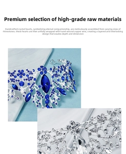 Detail of silver tiaras with blue and white crystals and intricate floral handcrafting