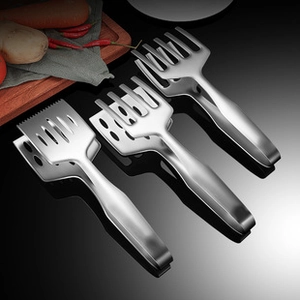 Three-piece stainless steel kitchen tongs set with slotted heads on black surface