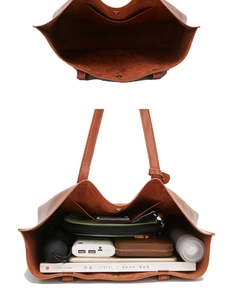 Spacious brown oil wax leather bucket bag showing large interior capacity for daily essentials