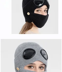 Detail of knitted aviator balaclava with goggles and face mask for winter warmth