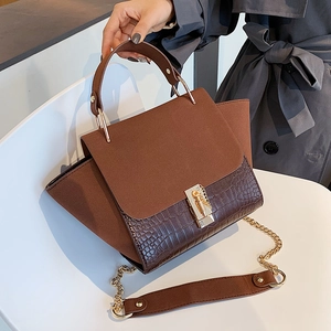 Brown frosted leather handbag with crocodile pattern and golden chain shoulder strap