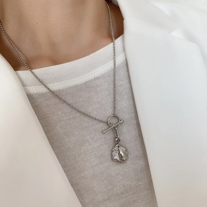 Detail of 925 sterling silver necklace with textured lava pendant and OT toggle clasp