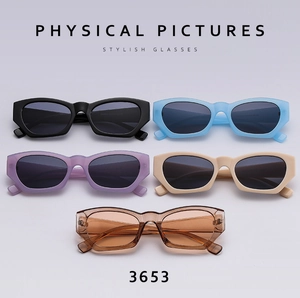 Flat lay of retro narrow frame sunglasses in five assorted colors with thick temples
