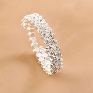 Elegant silver-tone elastic stretch bracelet fully set with sparkling clear rhinestones