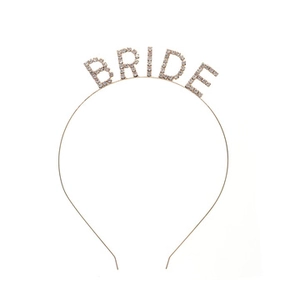 Detailed view of BRIDE rhinestone lettering on a silver bridal headband accessory