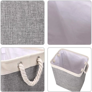 Grey linen fabric laundry basket with thick cotton rope handles and white inner lining
