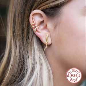 925 sterling silver gold snake earring set with textured scales on a female model