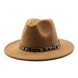 Detail of camel wool fedora hat featuring leopard print band and gold buckle