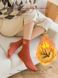 Detailed view of caramel winter cotton sock with warm fleece lining and bear embroidery