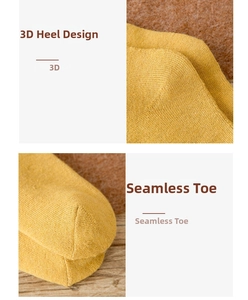 Detailed macro view of yellow thermal wool sock with seamless toe and 3D heel knitting