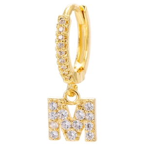 Detailed macro view of gold-plated hoop earring with micro-pave zircon letter M pendant