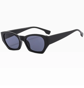 Close-up of retro black thick frame sunglasses with dark grey lenses in a 45-degree side view