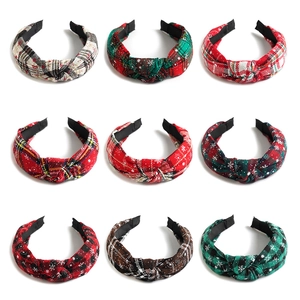 Set of 9 knotted Christmas headbands with plaid and snowflake patterns in various colors