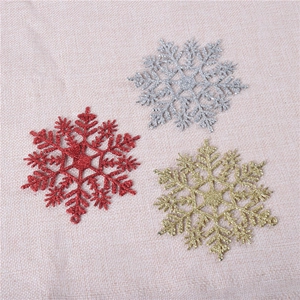 Sparkly 10cm acrylic snowflake ornaments in red gold and silver for Christmas tree decor