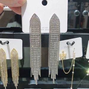 Detail of 925 silver needle long tassel earrings with sparkling rhinestone fringe