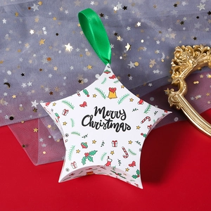 Star shaped Christmas gift box in white with green ribbon and Merry Christmas text