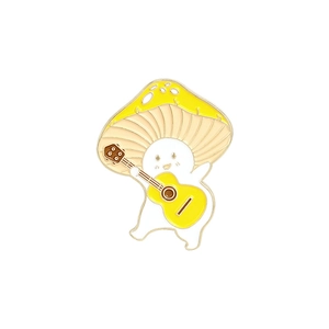 Close-up of cute enamel pin featuring a white creature with a yellow mushroom hat playing guitar