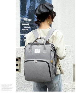 Front detail of a light grey multifunctional diaper backpack with durable oxford fabric