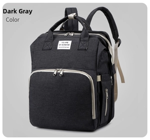 Detail of dark grey diaper backpack showing durable Oxford fabric and zipper pockets