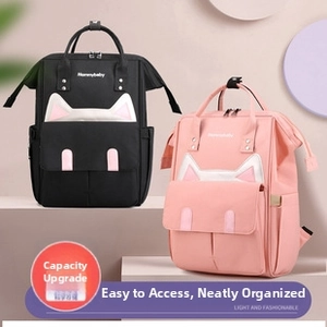 Front view of black and pink backpacks with cat ear design on geometric stands