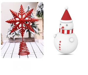 Detail view of red glitter snowflake tree topper and striped scarf snowman decoration