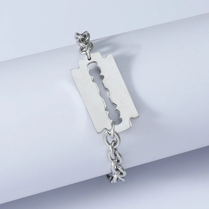 Men's hip hop stainless steel razor blade pendant bracelet on minimalist white display