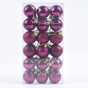 Detail of 36pcs magenta Christmas balls with glitter, matte and spiral textures in box