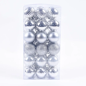 Close-up of 36 silver Christmas balls with matte, glitter and textured finishes in a box