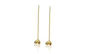 Detail of s925 silver heart tassel earrings with long chains in golden finish