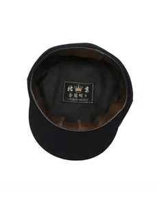 Detail view of the hat interior featuring a brown leather sweatband and inner size tag
