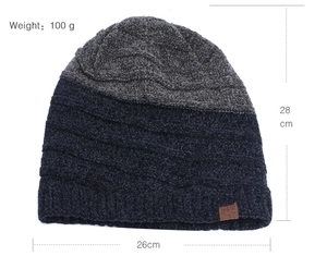Flat lay of a striped knit beanie with size markings of 28cm height and 26cm width