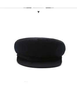 Front view of a minimalist dark navy cotton flat cap for elderly men on white background