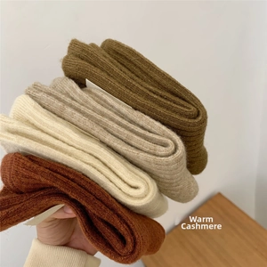Detail of multi-color thick ribbed knit wool socks with soft cashmere texture