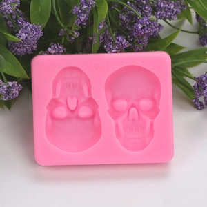 Pink silicone mold featuring dual skull designs for Halloween cake and chocolate decorating