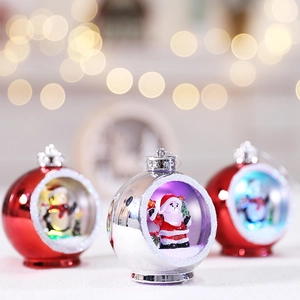 Glow Christmas balls with Santa and snowman scenes over festive golden bokeh background