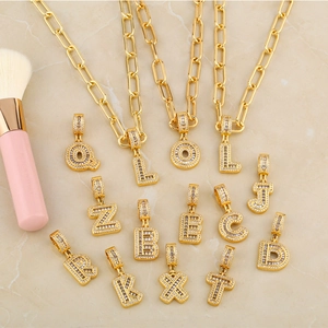 Gold paperclip chain necklace with personalized zircon-encrusted alphabet letter pendants
