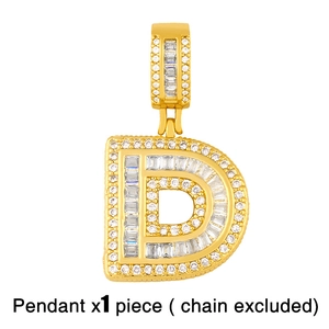 Close-up of golden letter D pendant with iced out cubic zirconia stones for hip hop style