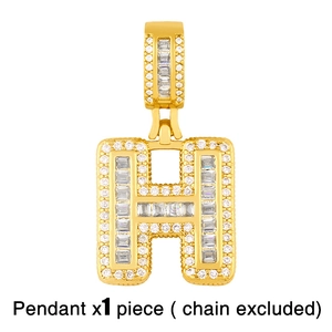 Close-up of gold-plated letter H pendant encrusted with white sparkling crystals
