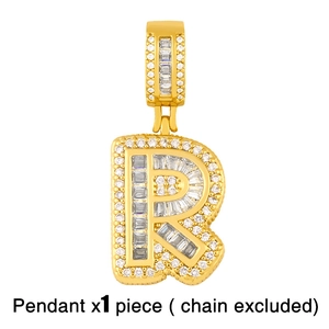 Macro detail of iced-out letter R pendant with baguette and round cut stones