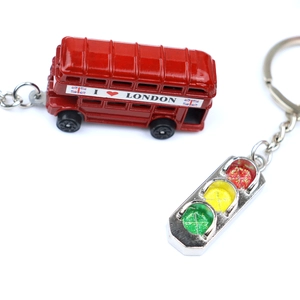 Close-up of red London bus keychain with I Love London text and silver traffic light
