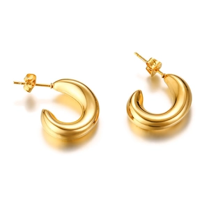 Close-up of polished gold-finished thick hoop earrings with classic butterfly backings