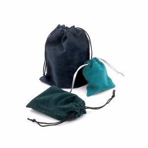 Velvet drawstring jewelry pouches in dark blue, dark green, and teal colors